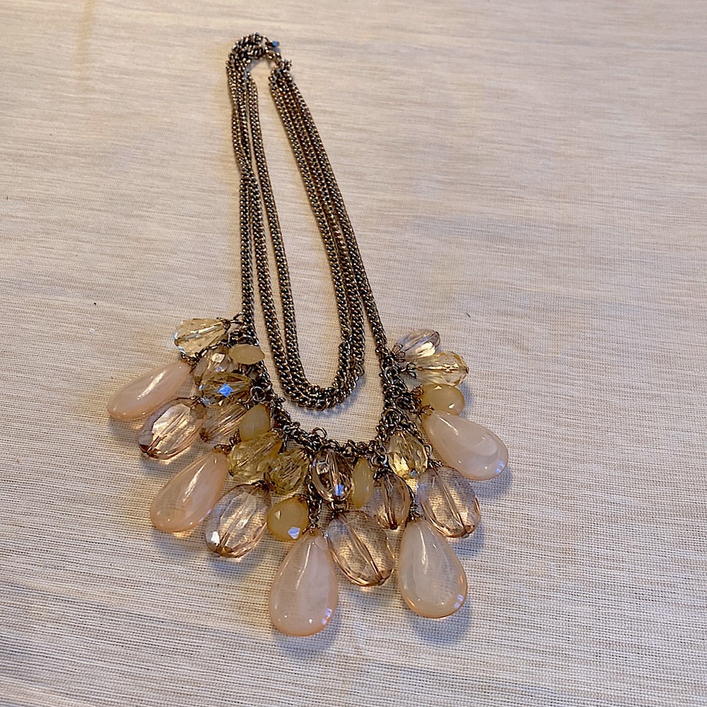 1 necklace with gold toned chain and beads that look like 3 necklaces!